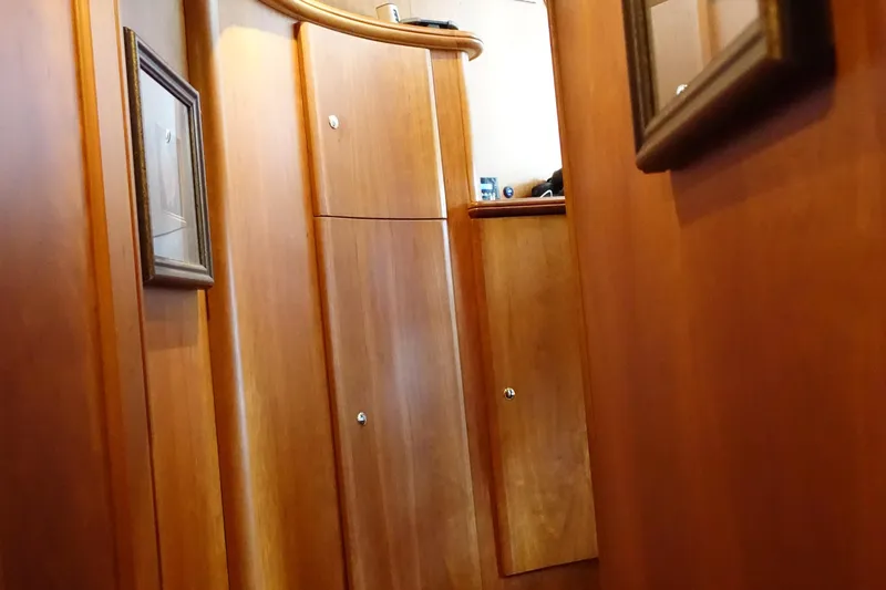  Yacht Photos Pics Interior of 2001 Silverton 410 Sport Bridge with wooden cabinetry and framed artwork.