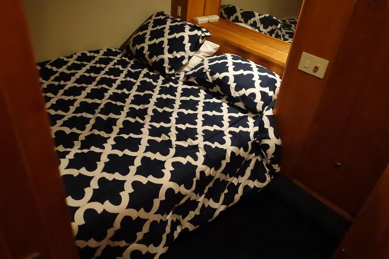  Yacht Photos Pics Cozy bedroom in 2001 Silverton 410 Sport Bridge with patterned bedding.