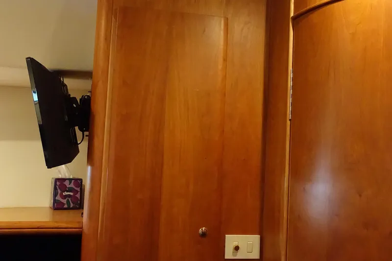  Yacht Photos Pics Interior of 2001 Silverton 410 Sport Bridge with mounted TV and wooden paneling.