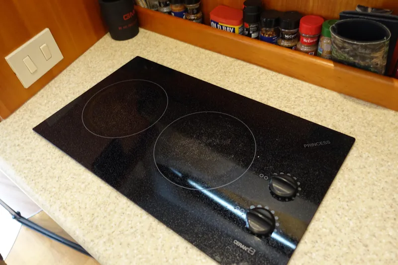  Yacht Photos Pics Electric stovetop on a 2001 Silverton 410 Sport Bridge yacht kitchen counter.