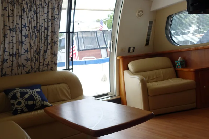  Yacht Photos Pics Interior of 2001 Silverton 410 Sport Bridge with cozy seating and nautical decor.