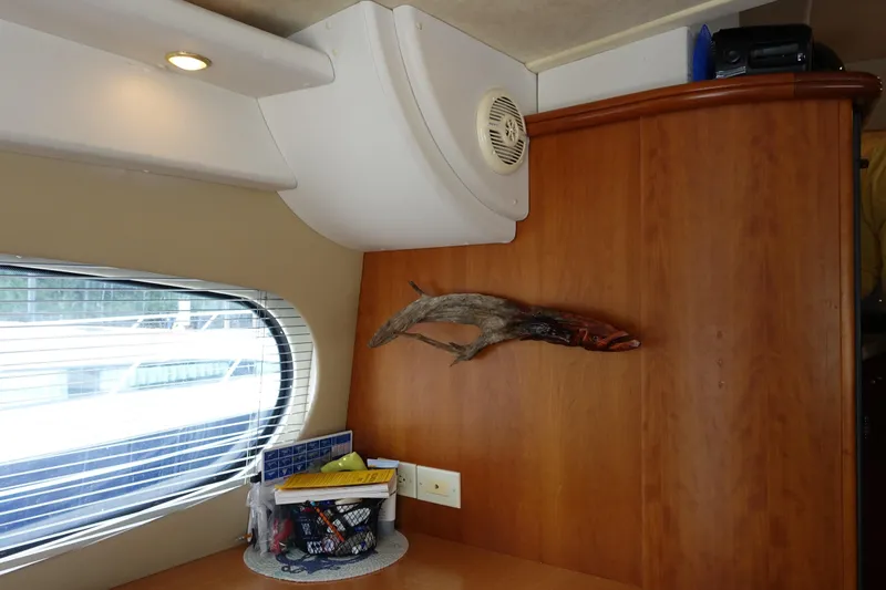  Yacht Photos Pics Interior of 2001 Silverton 410 Sport Bridge with wood paneling and window view.