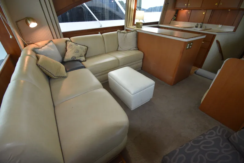 Series 60 Engines Yacht Photos Pics Interior of 2006 Ocean 46 Super Sport yacht with leather sofa and kitchen.