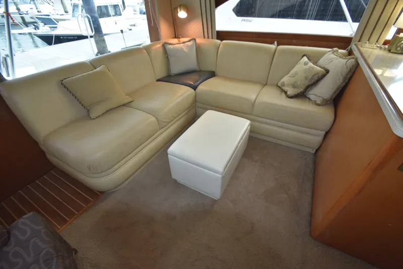 Series 60 Engines Yacht Photos Pics Interior of 2006 Ocean 46 Super Sport yacht with beige sofa and cushions.