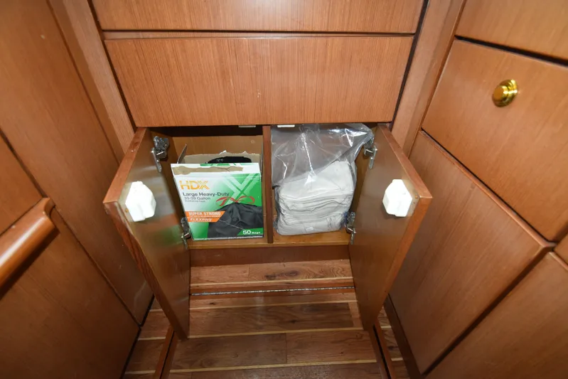 Series 60 Engines Yacht Photos Pics Kitchen cabinet with trash bags on Ocean 46 Super Sport, 2006.