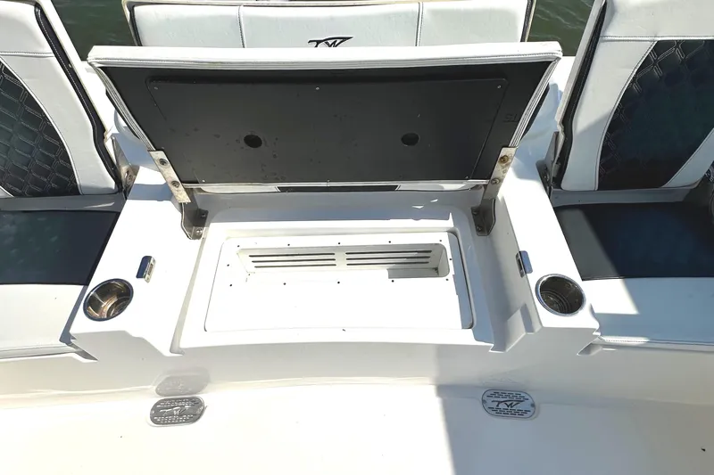  Yacht Photos Pics 2021 Tidewater 2700 Carolina Bay boat seating area with storage compartment open.