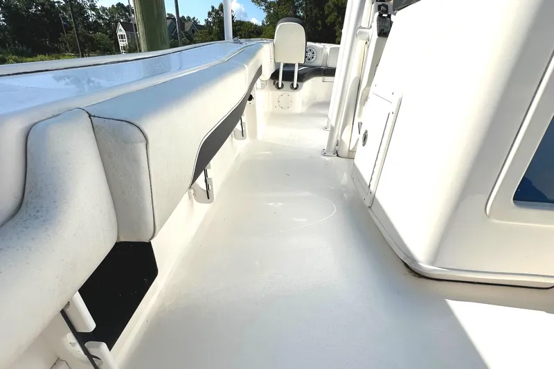  Yacht Photos Pics 2021 Tidewater 2700 Carolina Bay boat interior with white seating and clean deck.