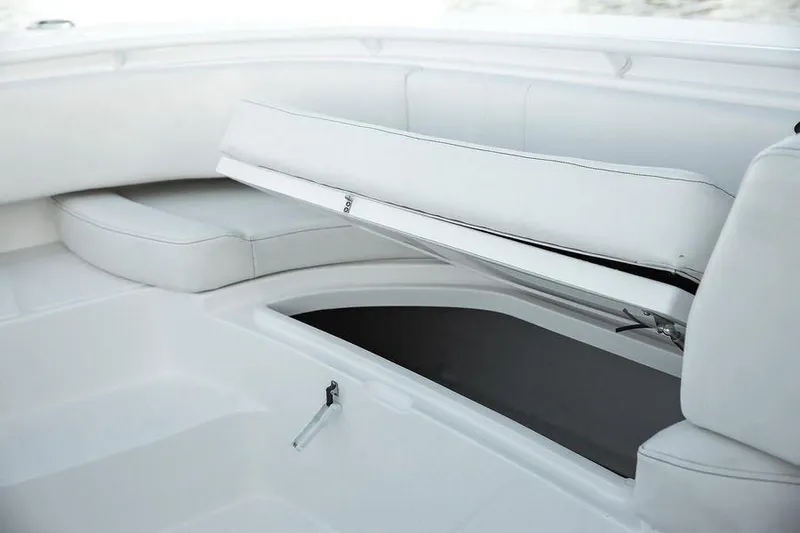 Fountain 34 Cc Yacht Photos Pics 2023 Fountain 34 CC boat interior with open storage compartment and white seating.