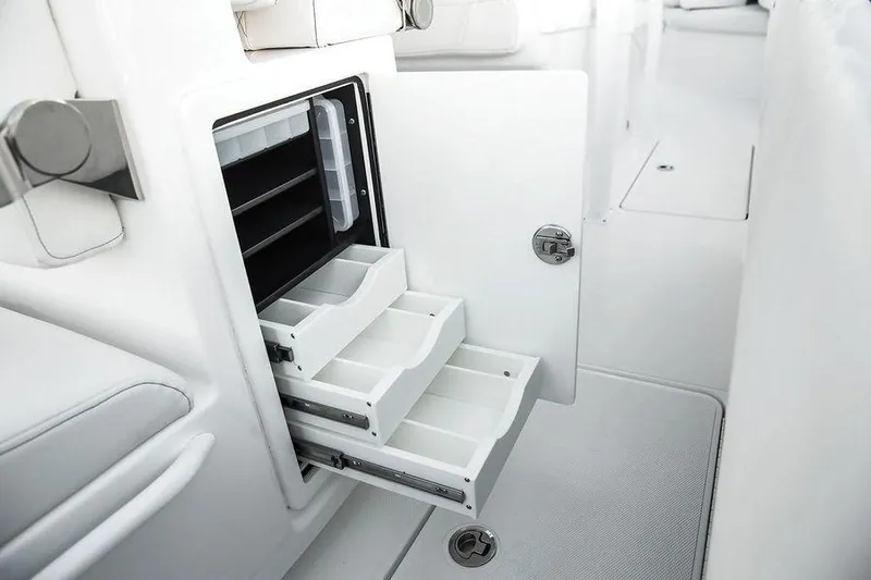 Fountain 34 Cc Yacht Photos Pics 2023 Fountain 34 CC boat interior with open storage compartments and sleek white design.