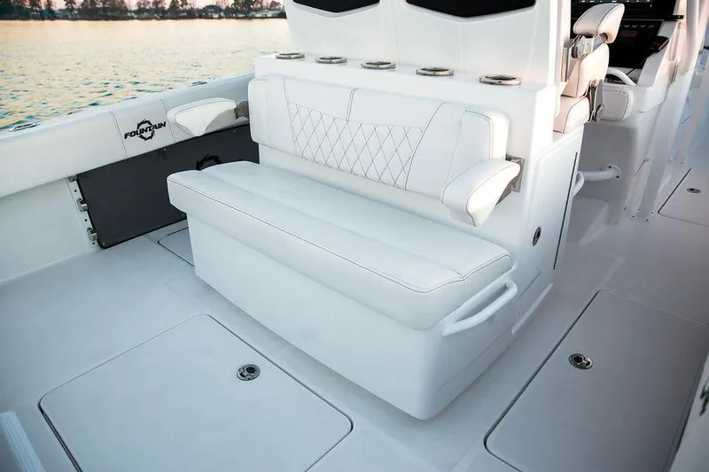 Fountain 34 Cc Yacht Photos Pics 2023 Fountain 34 CC boat interior with white seating and armrests.