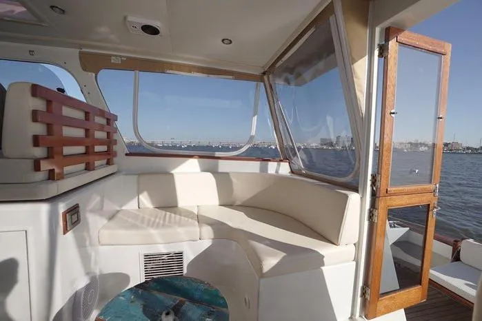 Faith Yacht Photos Pics Luxurious interior of 2003 Huckins Atlantic 44 yacht with waterfront view.