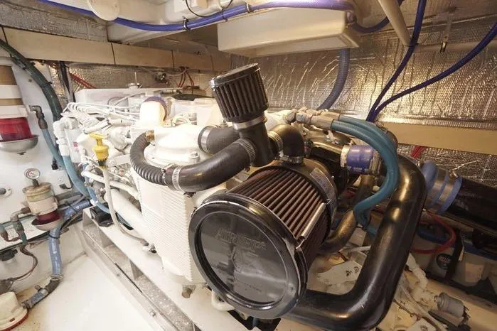 Faith Yacht Photos Pics Engine room of 2003 Huckins Atlantic 44 yacht, showcasing detailed mechanical components.