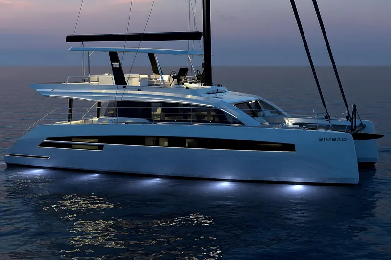  Yacht Photos Pics Luxurious 2025 Simbad 55 yacht illuminated at dusk on calm waters.