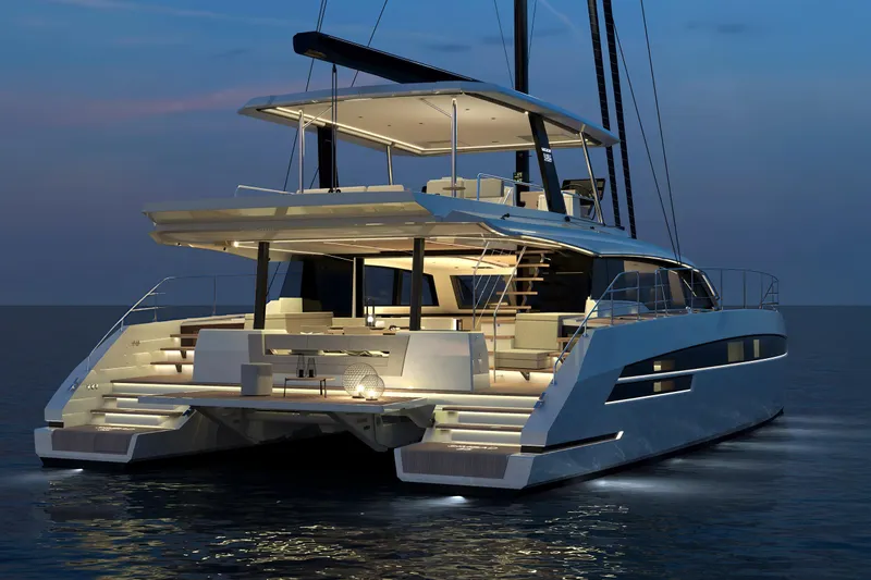  Yacht Photos Pics Luxurious 2025 Simbad 55 yacht illuminated at dusk on calm waters.