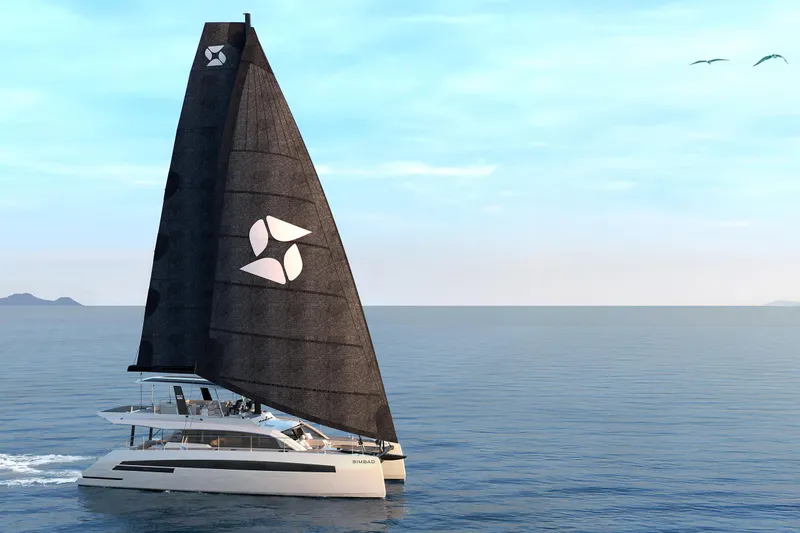  Yacht Photos Pics Modern Simbad 55 catamaran sailing on open sea, 2025 model, with sleek black sails.
