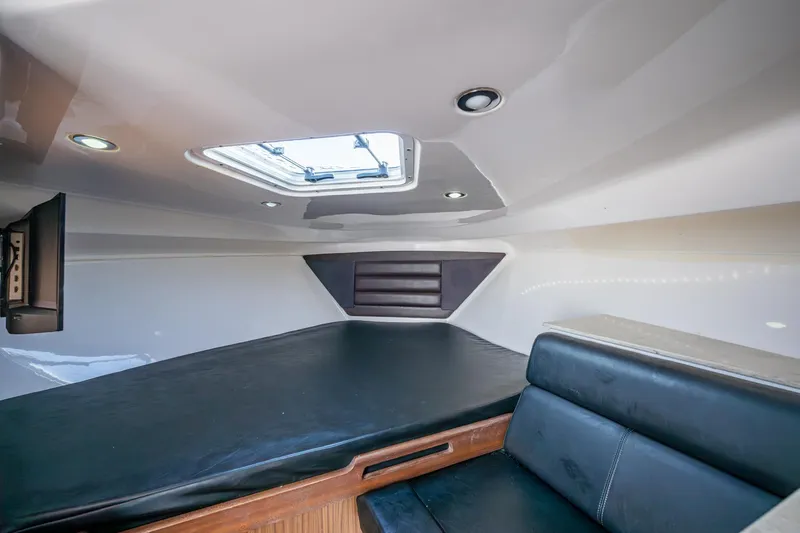 Kirby 107 Yacht Photos Pics Interior cabin of 2014 Everglades 350LX boat with skylight and seating.