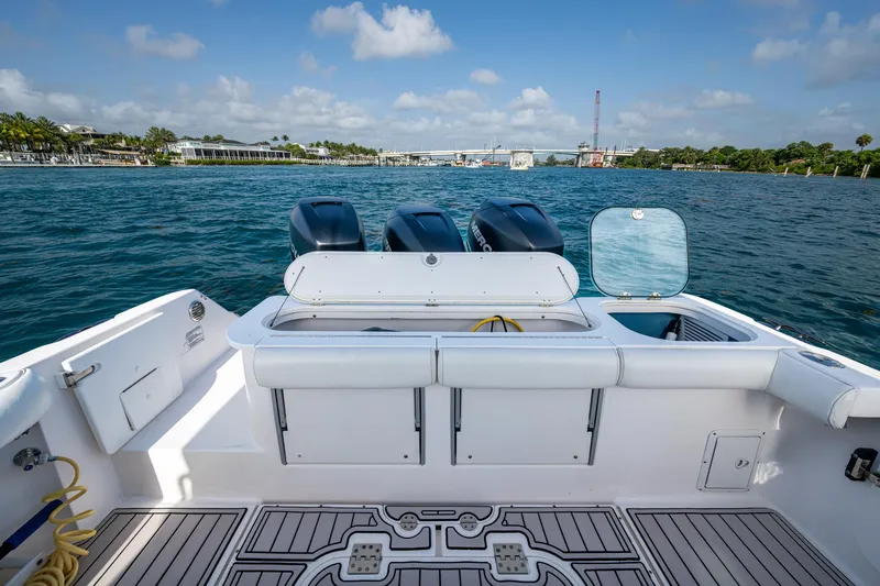 Kirby 107 Yacht Photos Pics 2014 Everglades 350LX boat with triple engines on a sunny day at sea.