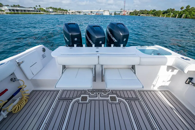 Kirby 107 Yacht Photos Pics 2014 Everglades 350LX boat with triple Mercury engines on a calm waterway.