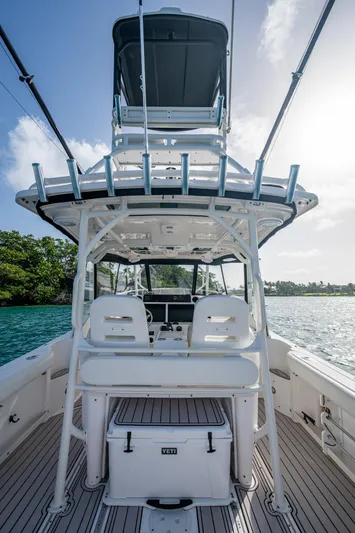 Kirby 107 Yacht Photos Pics 2014 Everglades 350LX boat interior with seating and fishing equipment, on a sunny day.