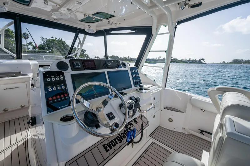Kirby 107 Yacht Photos Pics Interior of 2014 Everglades 350LX boat with modern dashboard and ocean view.