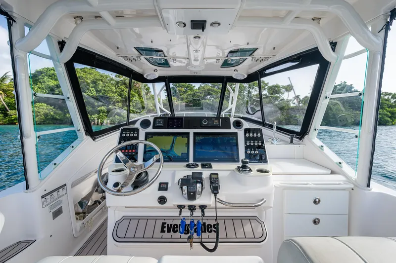 Kirby 107 Yacht Photos Pics Cockpit of 2014 Everglades 350LX boat with advanced navigation systems and scenic water view.