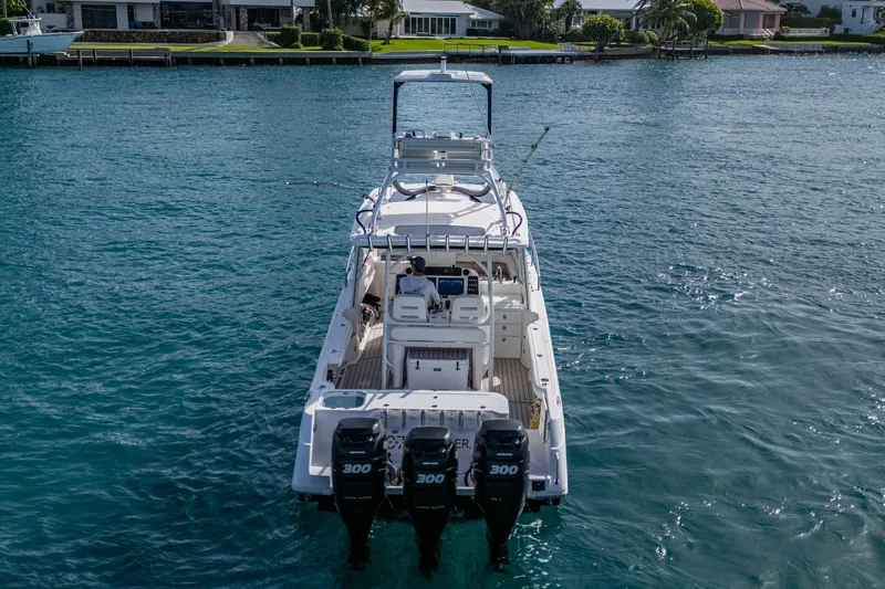 Kirby 107 Yacht Photos Pics 2014 Everglades 350LX boat on water, featuring triple 300 horsepower engines.