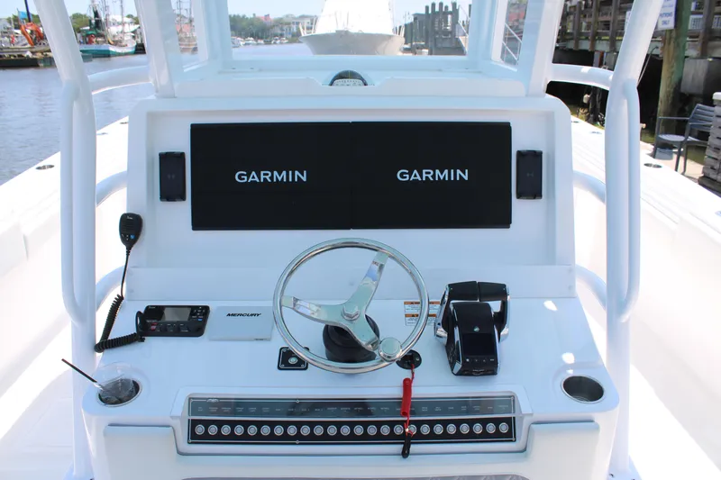  Yacht Photos Pics 2025 Invincible 35 Catamaran helm with Garmin displays and Mercury controls.