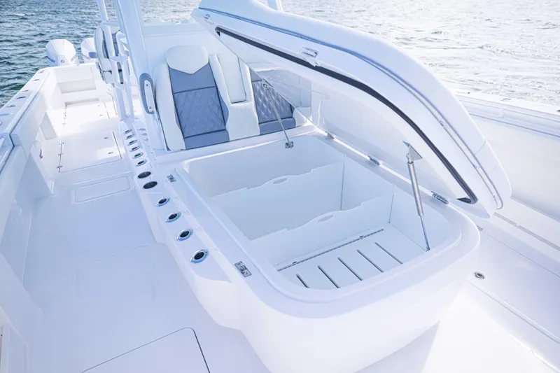  Yacht Photos Pics 2025 Invincible 35 Catamaran with open storage compartment, sleek seating, and ocean backdrop.