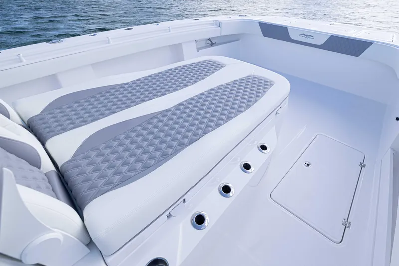  Yacht Photos Pics 2025 Invincible 35 Catamaran interior with cushioned seating and ocean backdrop.