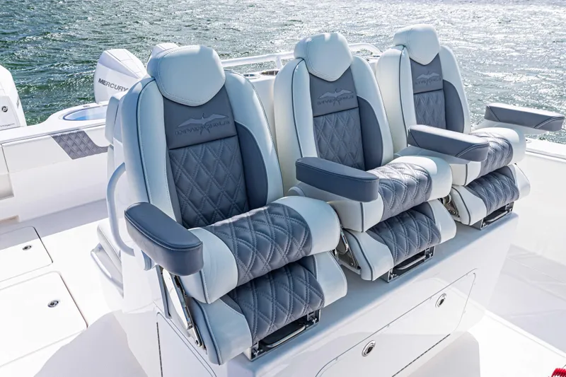  Yacht Photos Pics Luxurious seating on 2025 Invincible 35 Catamaran, featuring plush, diamond-stitched upholstery.