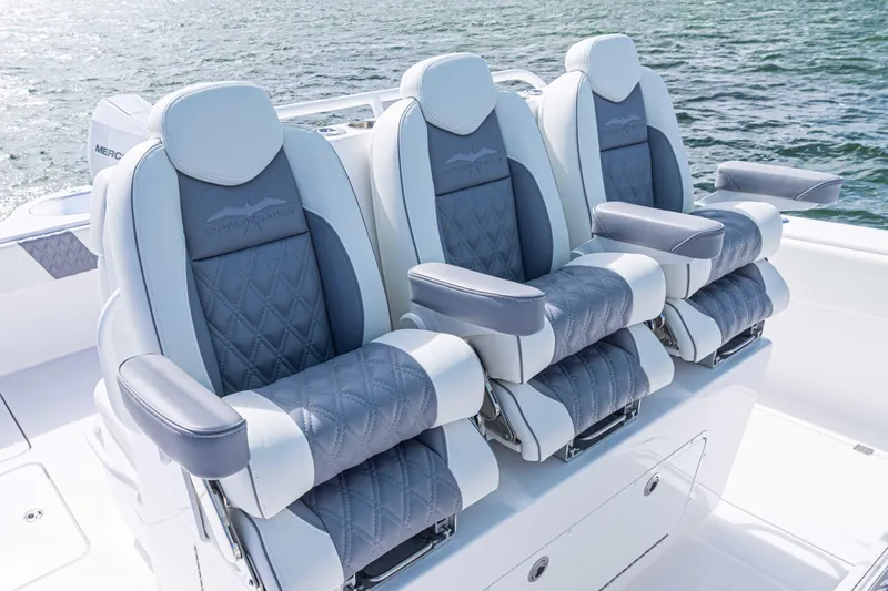  Yacht Photos Pics Luxurious seating on 2025 Invincible 35 Catamaran, featuring plush, ergonomic design with ocean backdrop.