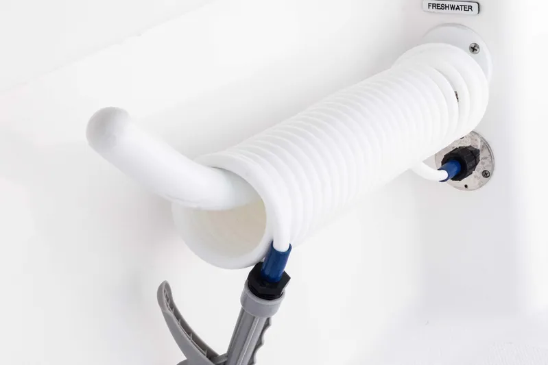  Yacht Photos Pics Coiled freshwater hose on 2025 Invincible 35 Catamaran.