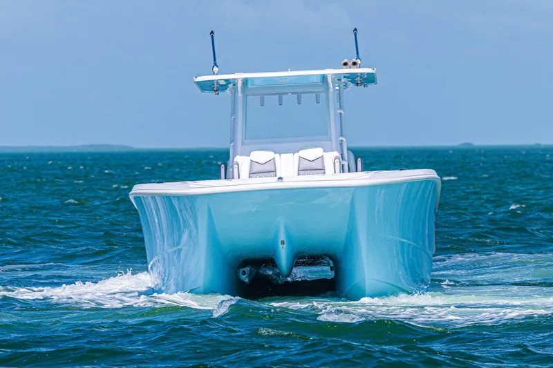  Yacht Photos Pics 2025 Invincible 35 Catamaran cruising on open water, showcasing sleek design and performance.