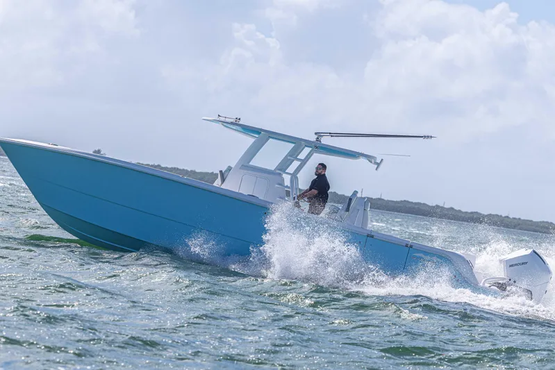  Yacht Photos Pics 2025 Invincible 35 Catamaran cruising on open water, showcasing sleek design and performance.