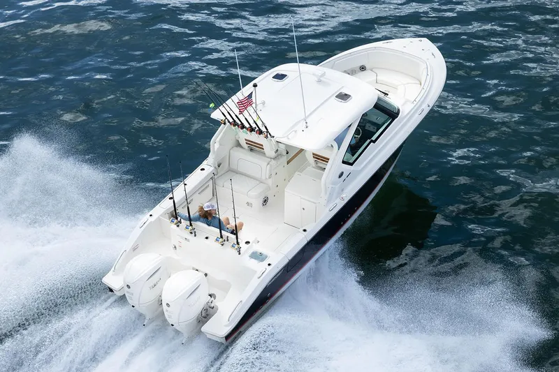  Yacht Photos Pics Manufacturer Provided Image: 2025 Pursuit DC 326 Dual Console boat cruising on open water.