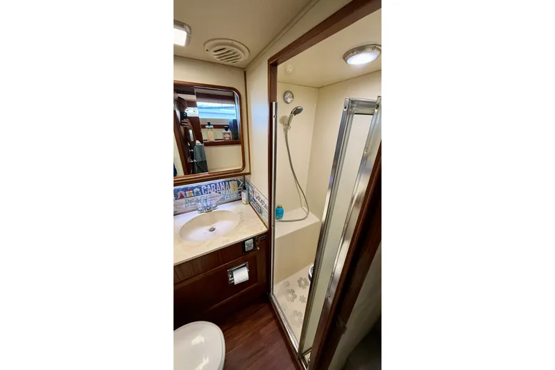 Moonlight Mist Yacht Photos Pics 1987 Chris-Craft 500 Constellation yacht bathroom with shower and sink area.