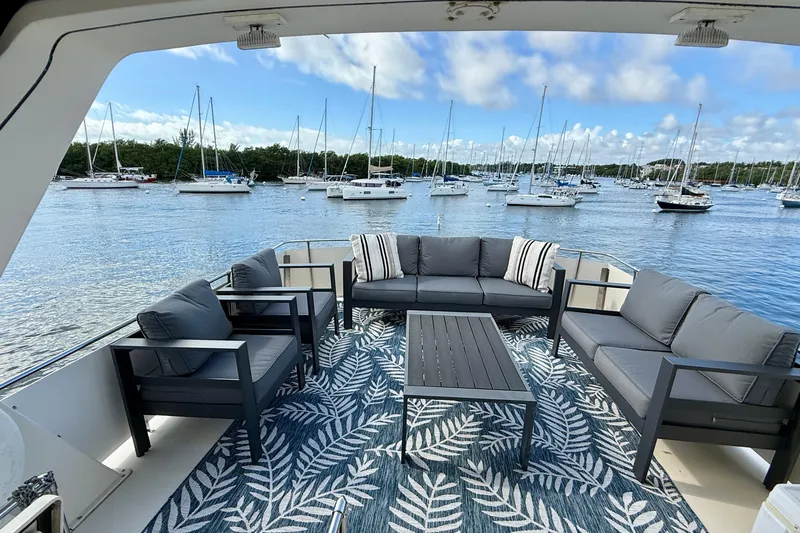 Moonlight Mist Yacht Photos Pics Luxurious 1987 Chris-Craft 500 Constellation yacht deck with elegant seating and scenic marina view.