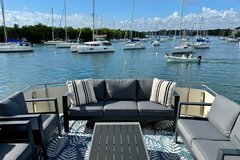 Moonlight Mist Yacht Photos Pics Luxurious 1987 Chris-Craft 500 Constellation yacht deck with elegant seating, overlooking serene marina.