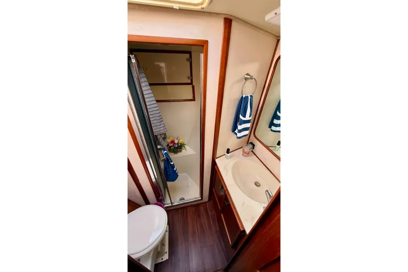 Moonlight Mist Yacht Photos Pics Bathroom interior of 1987 Chris-Craft 500 Constellation yacht with sink and shower.
