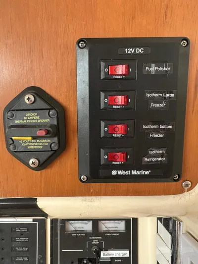 Bat Ha Yam Yacht Photos Pics Electrical panel on a 2001 Leopard 47 boat with labeled switches and reset buttons.