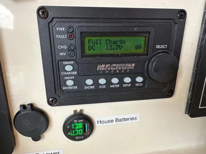 Bat Ha Yam Yacht Photos Pics Control panel on a 2001 Leopard 47 showing full battery charge at 13.7V.