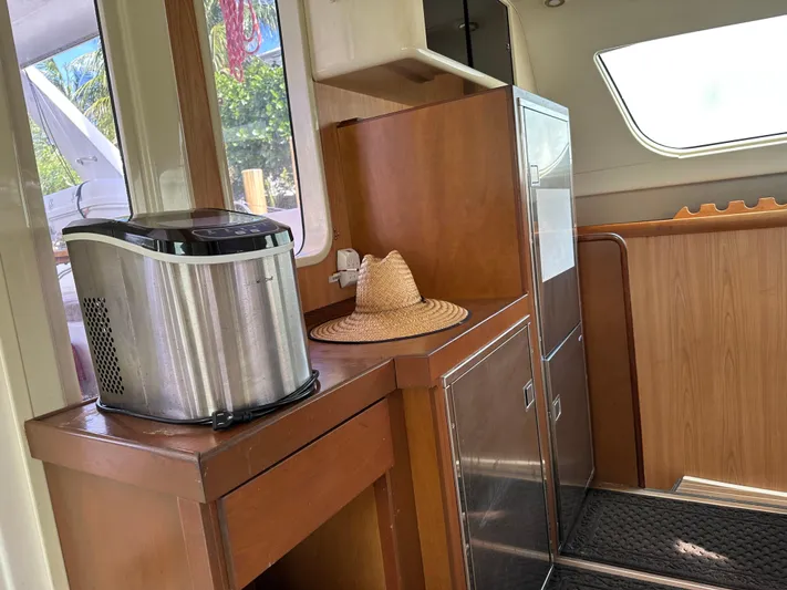 Bat Ha Yam Yacht Photos Pics Interior of a 2001 Leopard 47 yacht with a hat and ice maker.