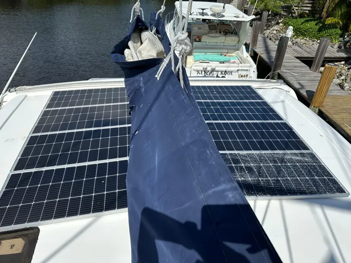 Bat Ha Yam Yacht Photos Pics Solar panels on a 2001 Leopard 47 catamaran docked by the water.