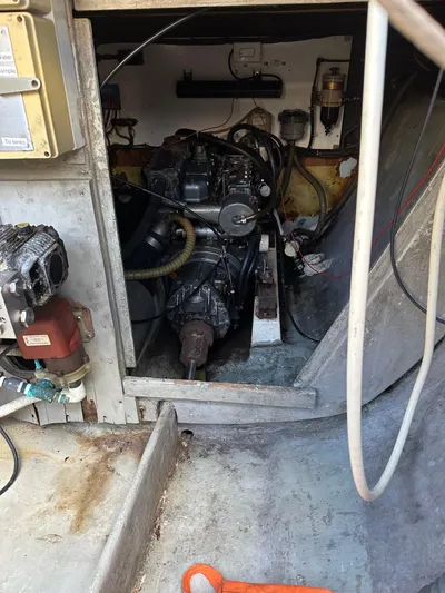 Bat Ha Yam Yacht Photos Pics Engine compartment of a 2001 Leopard 47 catamaran, showcasing mechanical components and wiring.