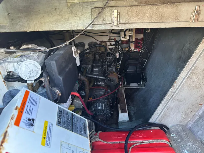 Bat Ha Yam Yacht Photos Pics Engine compartment of a 2001 Leopard 47 catamaran, showing mechanical components and wiring.