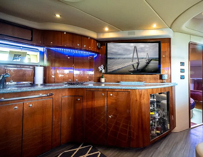 Carolina Girl Yacht Photos Pics Luxurious interior of 2002 Sea Ray 550 Sundancer yacht with modern kitchen amenities.