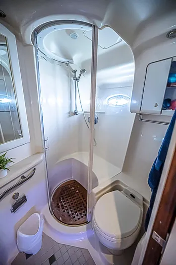 Carolina Girl Yacht Photos Pics Bathroom interior of 2002 Sea Ray 550 Sundancer yacht with shower and toilet.