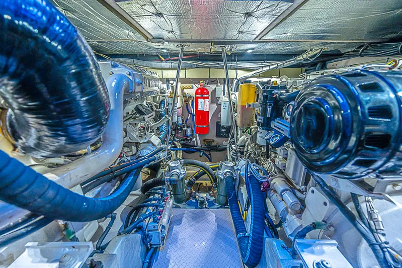 Carolina Girl Yacht Photos Pics Engine room of a 2002 Sea Ray 550 Sundancer, showcasing complex machinery and equipment.