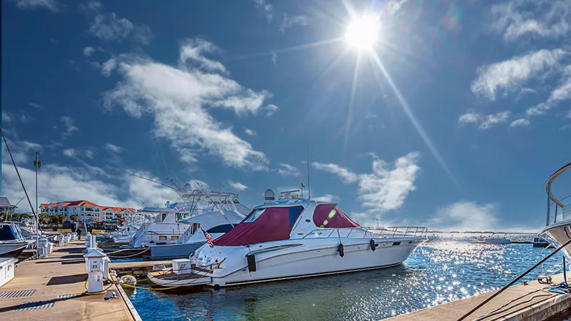 Carolina Girl Yacht Photos Pics 2002 Sea Ray 550 Sundancer yacht docked under a bright sunlit sky.