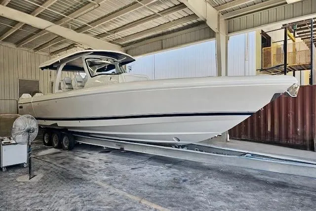  Yacht Photos Pics 2025 Intrepid 43 Nomad SE boat in a covered storage facility.